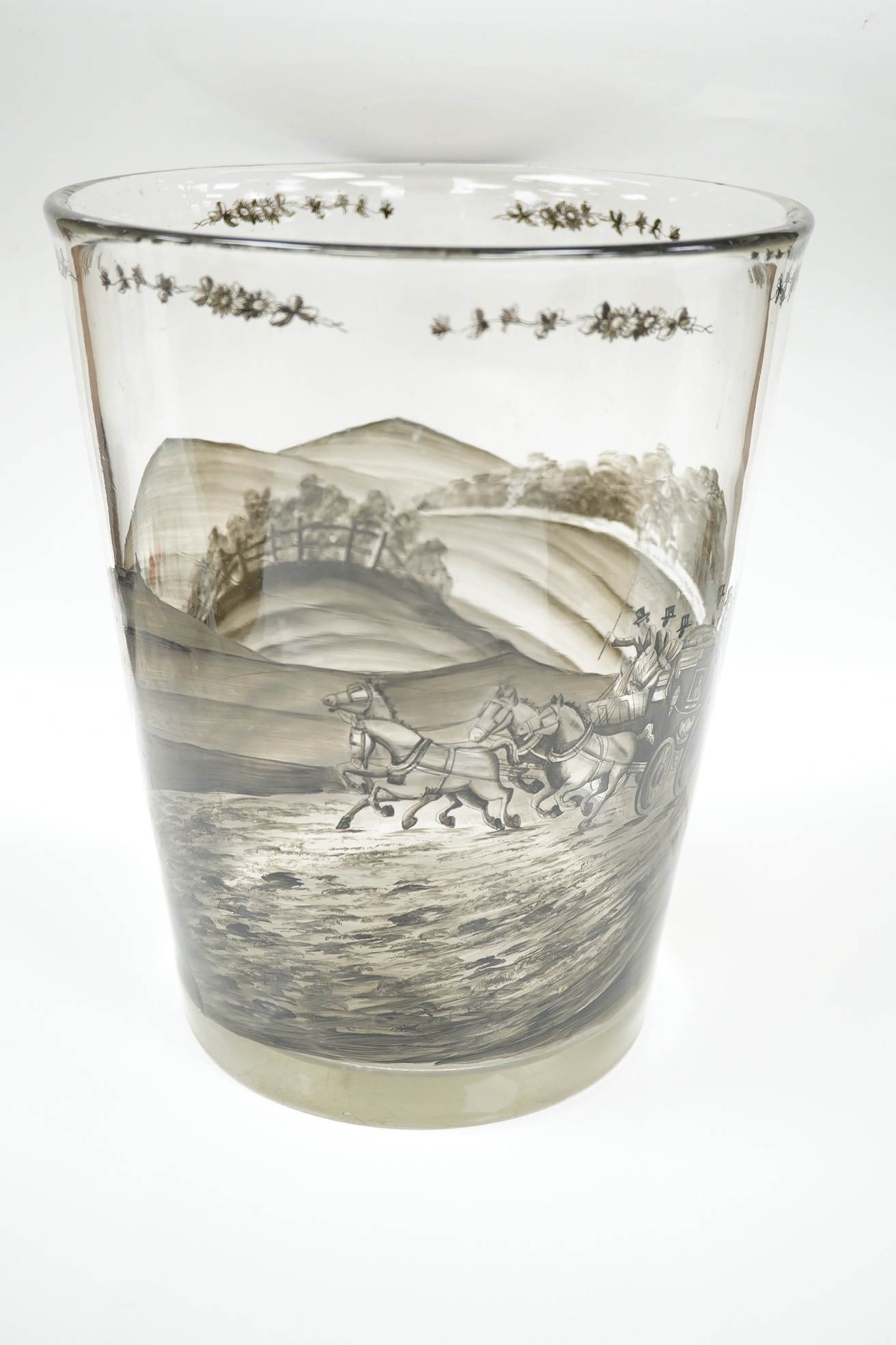 A large German Schwarzlot glass beaker vase, decorated with a painted agricultural scene, 27.5cm high. Condition - fair to good, one chip to the rim and scratches to the base